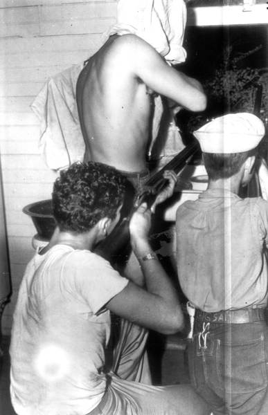 Three young ex-servicemen firing at the jail in Athens, Tennessee, 1946