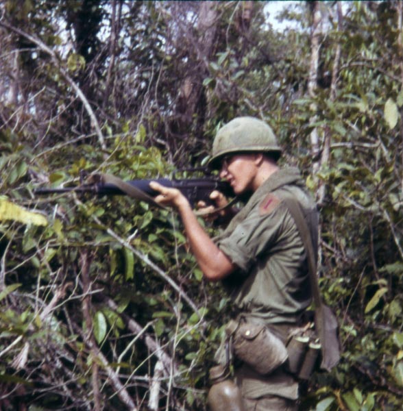 Christopher Ammons firing an M16
