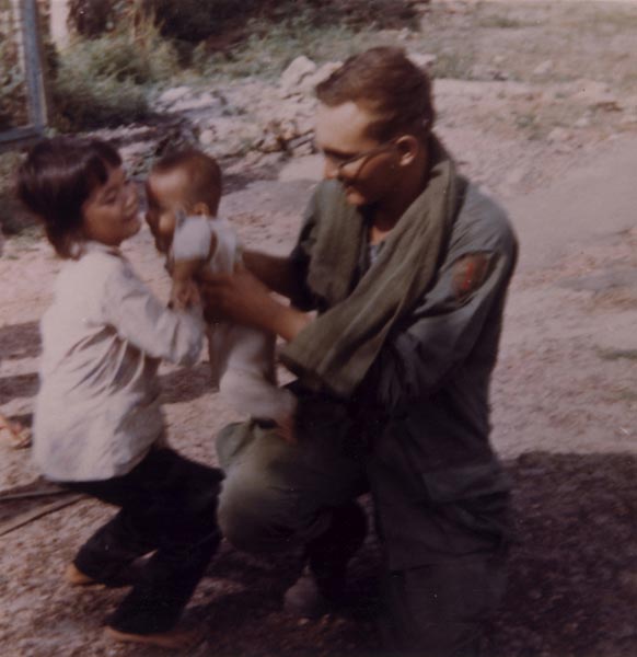 Christopher Ammons with Vietnamese children